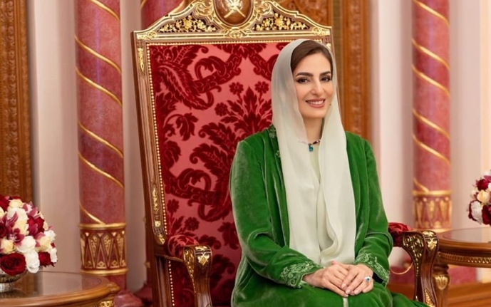 The esteemed lady congratulates the teachers on their annual day.